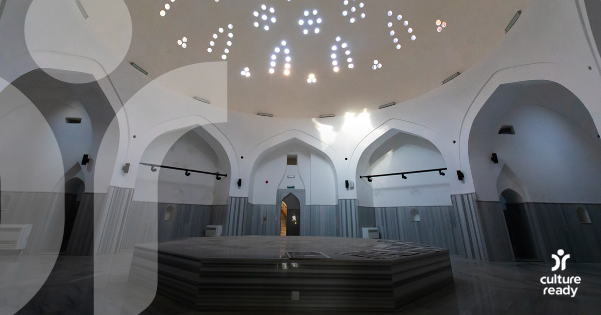 The inside of a Turkey Hammam with five arches and a domed ceiling with intracate skylights